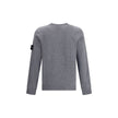 Gray Wool SweatshirtWool Sweater by Stone Island featuring a ribbed crew neck, a logo patch applied to the left sleeve and ribbed trim at the cuffs and hem. The monochrome design enhances the clean lines of the garment, perfect for a casual yet polished l
