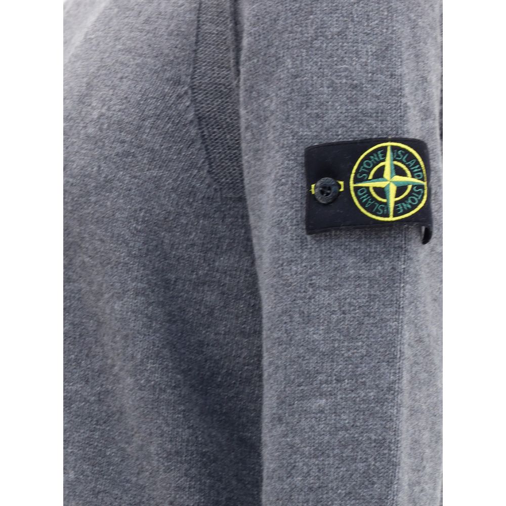 Gray Wool SweatshirtWool Sweater by Stone Island featuring a ribbed crew neck, a logo patch applied to the left sleeve and ribbed trim at the cuffs and hem. The monochrome design enhances the clean lines of the garment, perfect for a casual yet polished l