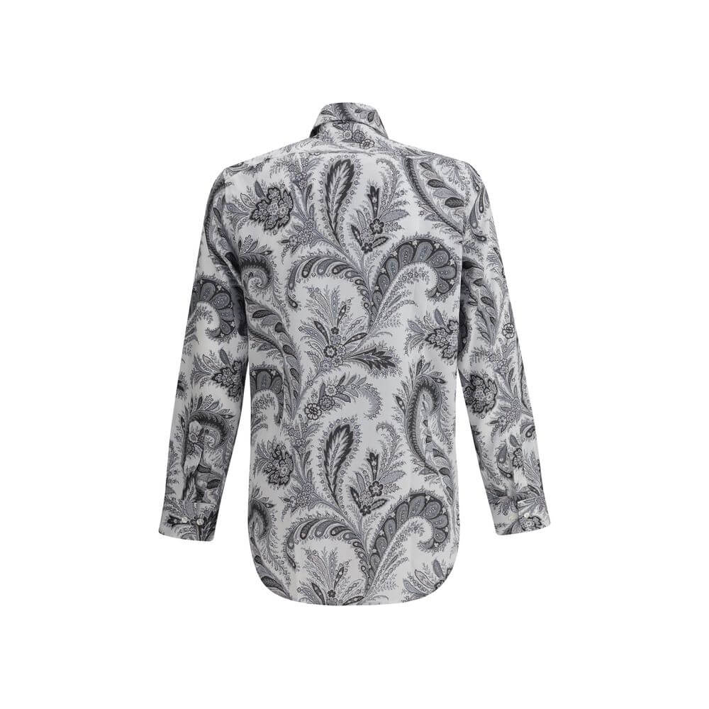 Gray Cotton Pattern ShirtCotton Roma Shirt by Etro features a classic collar and front button closure for a clean, versatile look. Adjustable button cuffs ensure a customizable fit. The garment features the iconic contrasting paisley pattern, the brand’s
