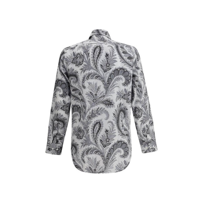Gray Cotton Pattern ShirtCotton Roma Shirt by Etro features a classic collar and front button closure for a clean, versatile look. Adjustable button cuffs ensure a customizable fit. The garment features the iconic contrasting paisley pattern, the brand’s
