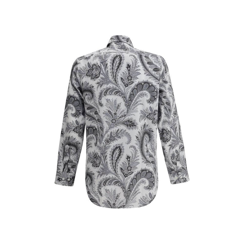 Gray Cotton Pattern ShirtCotton Roma Shirt by Etro features a classic collar and front button closure for a clean, versatile look. Adjustable button cuffs ensure a customizable fit. The garment features the iconic contrasting paisley pattern, the brand’s
