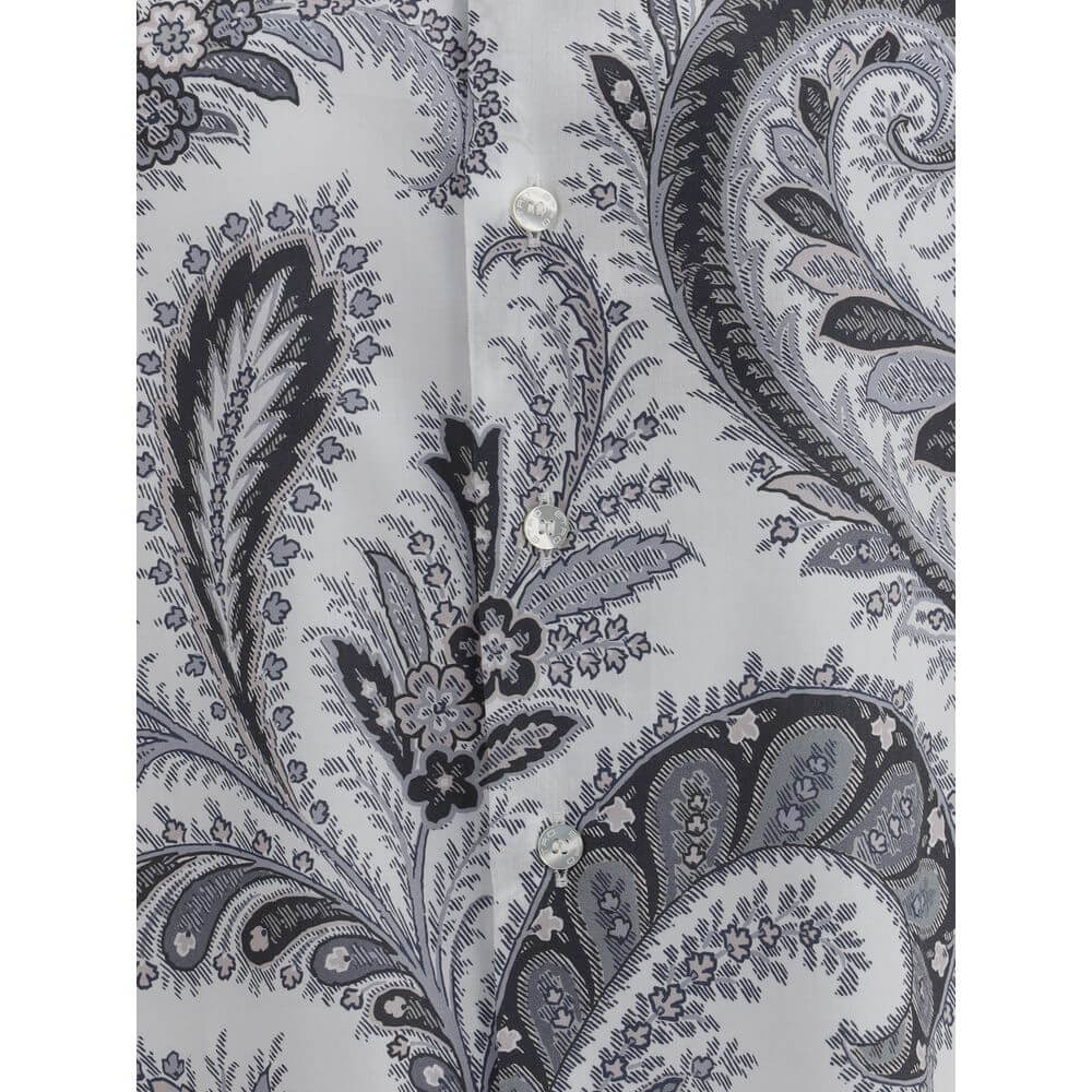 Gray Cotton Pattern ShirtCotton Roma Shirt by Etro features a classic collar and front button closure for a clean, versatile look. Adjustable button cuffs ensure a customizable fit. The garment features the iconic contrasting paisley pattern, the brand’s