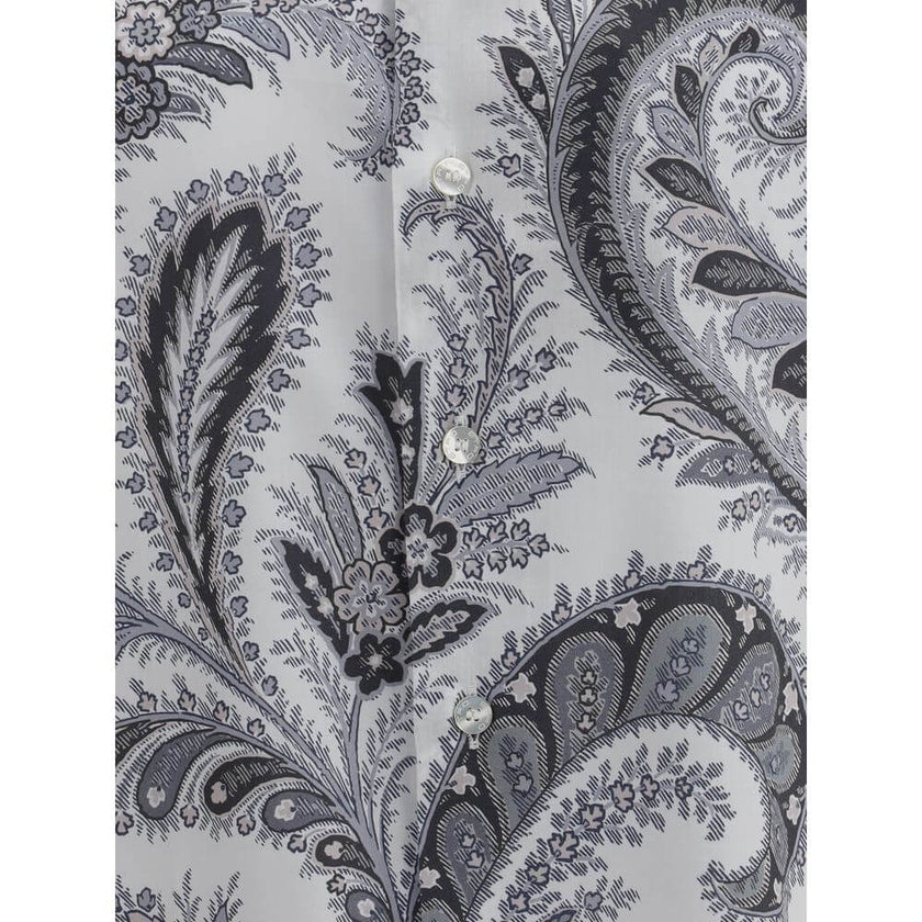 Gray Cotton Pattern ShirtCotton Roma Shirt by Etro features a classic collar and front button closure for a clean, versatile look. Adjustable button cuffs ensure a customizable fit. The garment features the iconic contrasting paisley pattern, the brand’s