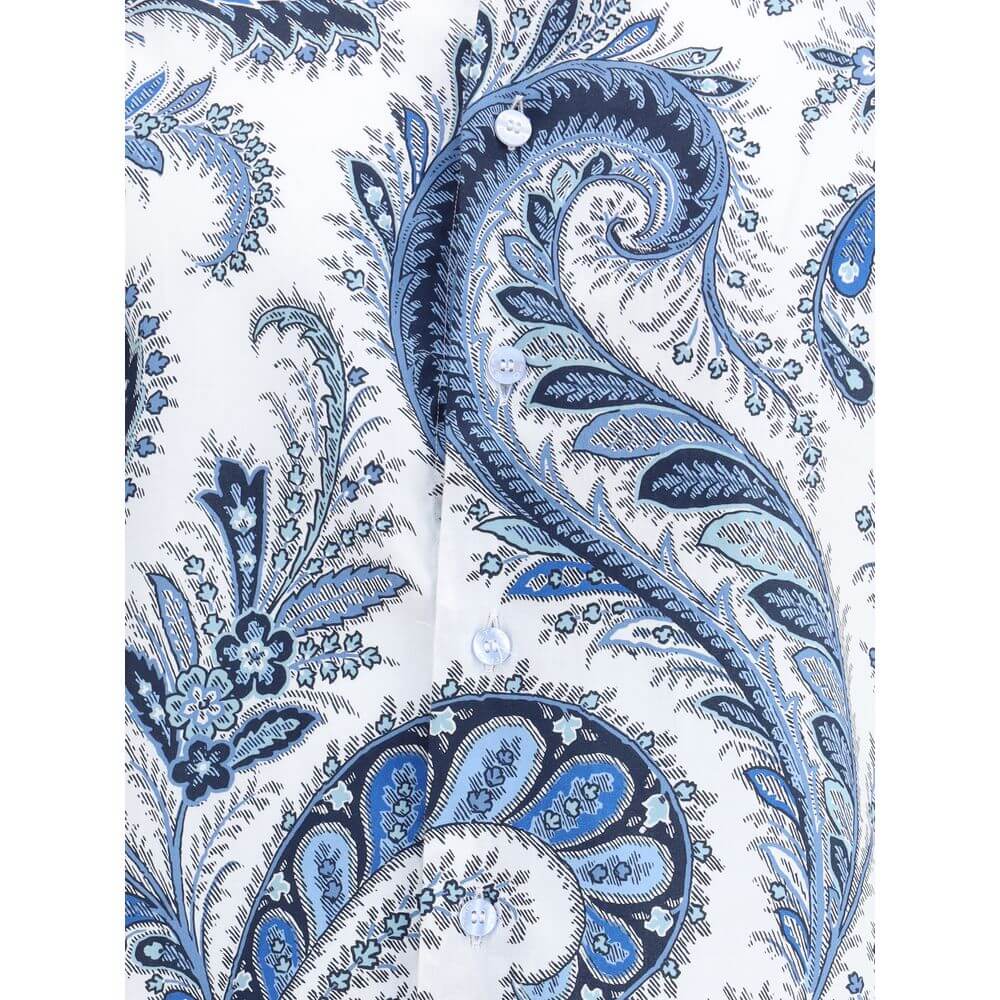 Blue Cotton Pattern ShirtCotton Roma Shirt by Etro features a classic collar and front button closure for a clean, versatile look. Adjustable button cuffs ensure a customizable fit. The garment features the iconic contrasting paisley pattern, the brand’s