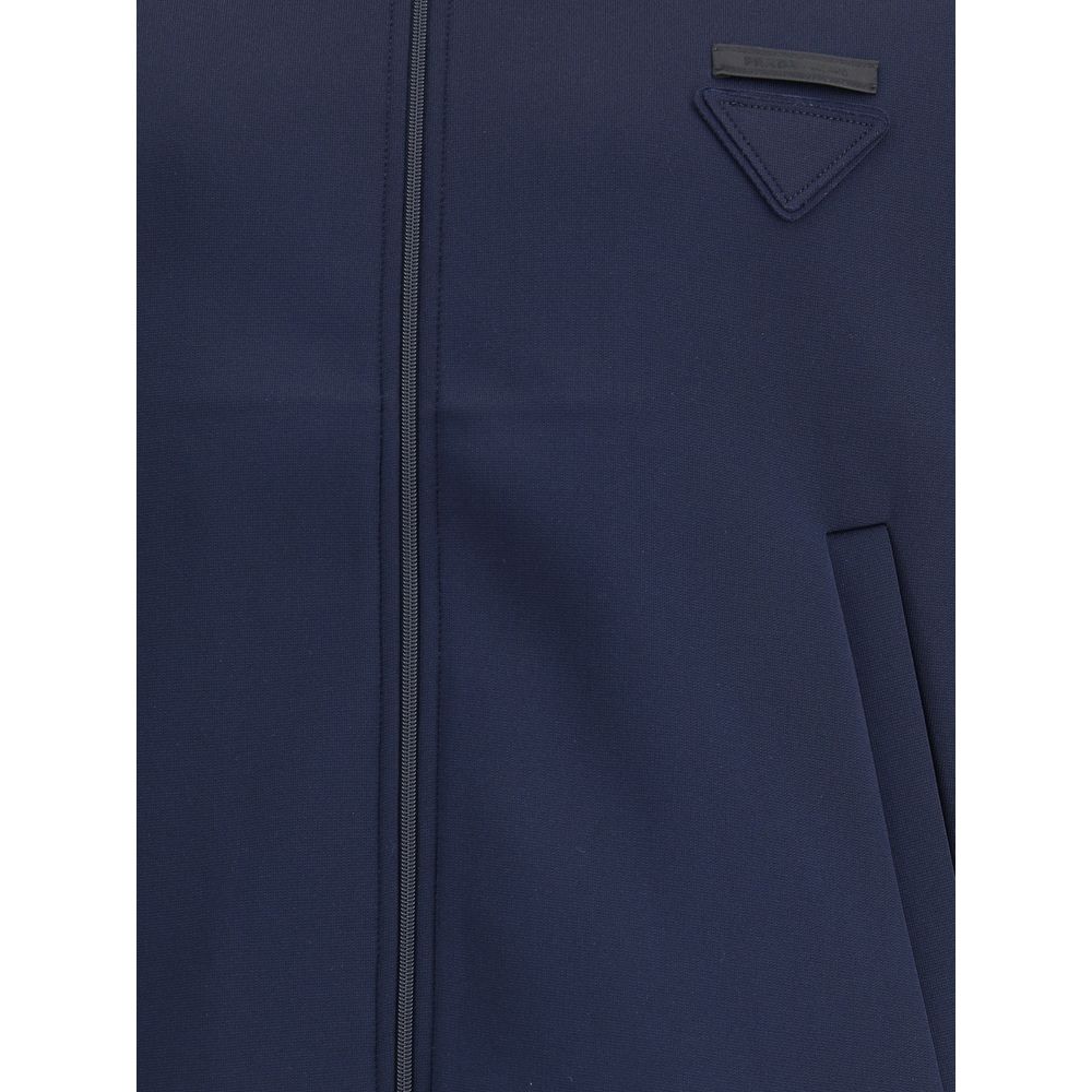 Blue Polyester SweatshirtContemporary style Sweatshirt by Prada, made with a high collar and front zipper closure. Raglan sleeves ensure comfort and freedom of movement, while the two side welt pockets offer practicality and a functional touch. The design