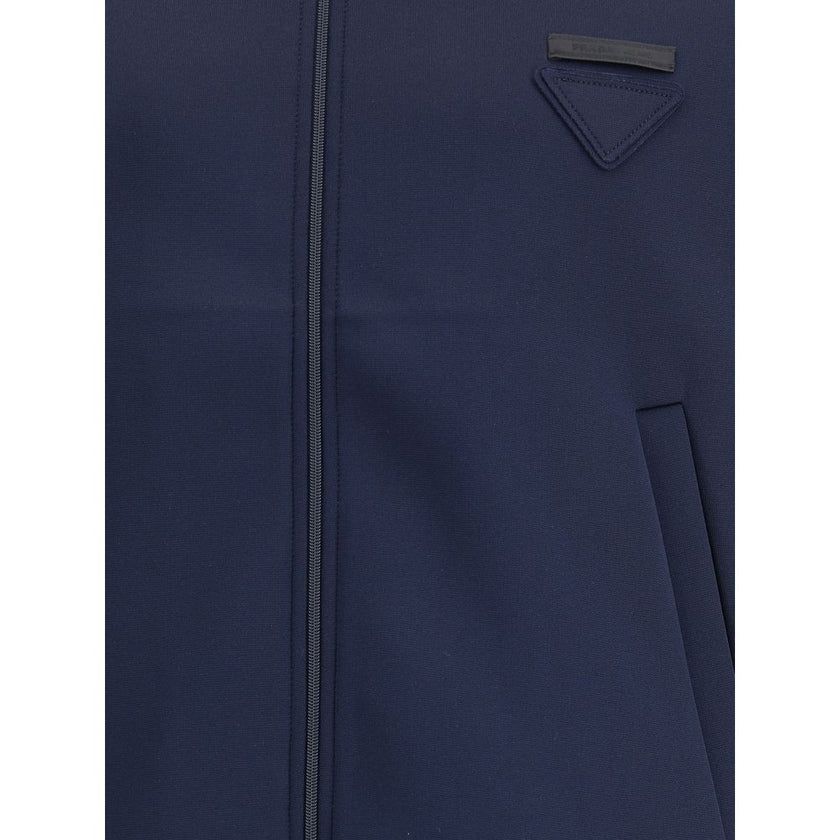 Blue Polyester SweatshirtContemporary style Sweatshirt by Prada, made with a high collar and front zipper closure. Raglan sleeves ensure comfort and freedom of movement, while the two side welt pockets offer practicality and a functional touch. The design