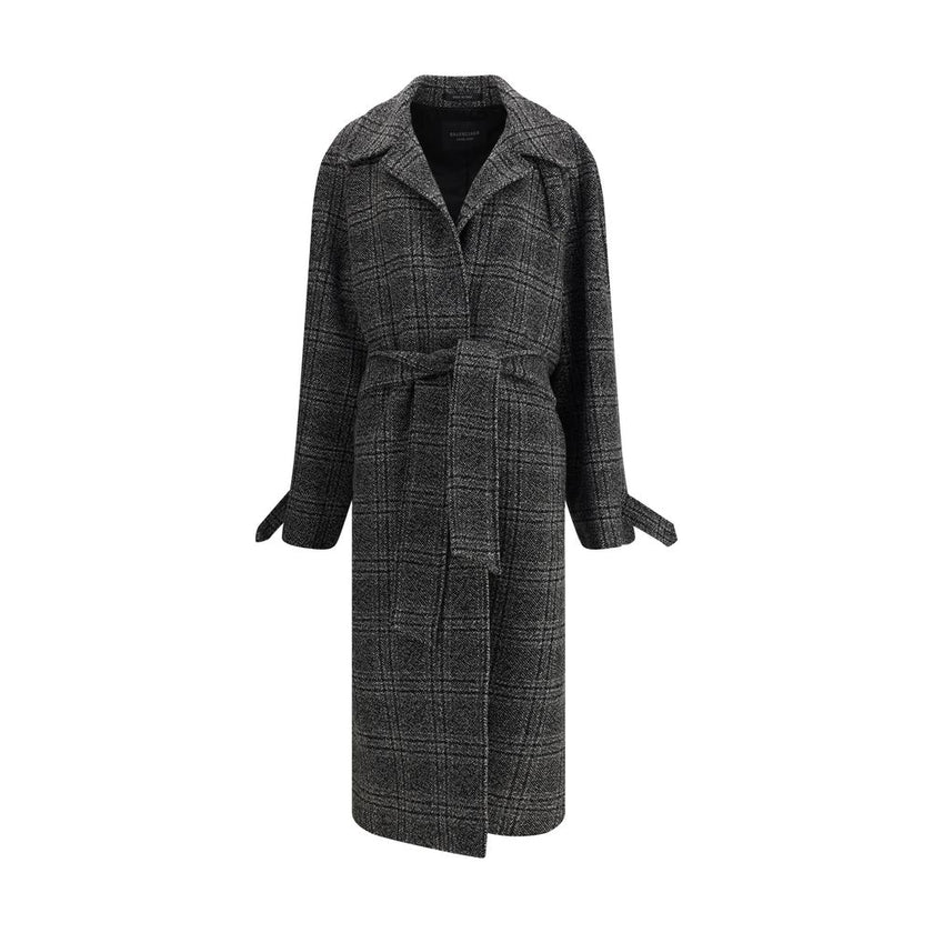 Gray Wool CoatBalenciaga’s Long Coat is a statement piece that combines elegance and character. Crafted from wool with a refined checked design, it features welt pockets on the front and distinctive details such as belt loops on the collar and sleeve. The