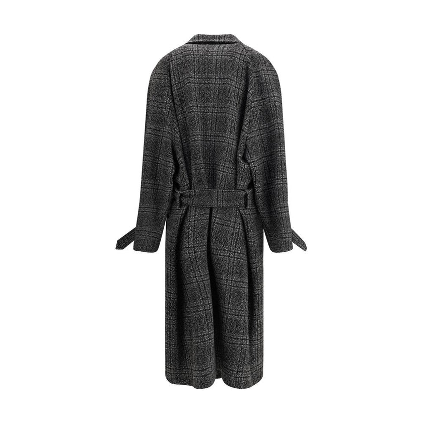 Gray Wool CoatBalenciaga’s Long Coat is a statement piece that combines elegance and character. Crafted from wool with a refined checked design, it features welt pockets on the front and distinctive details such as belt loops on the collar and sleeve. The