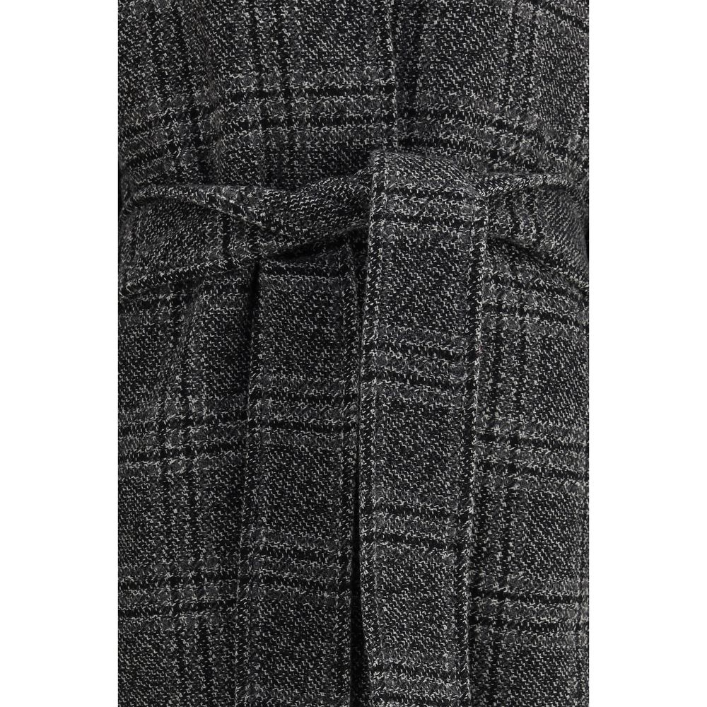 Gray Wool CoatBalenciaga’s Long Coat is a statement piece that combines elegance and character. Crafted from wool with a refined checked design, it features welt pockets on the front and distinctive details such as belt loops on the collar and sleeve. The