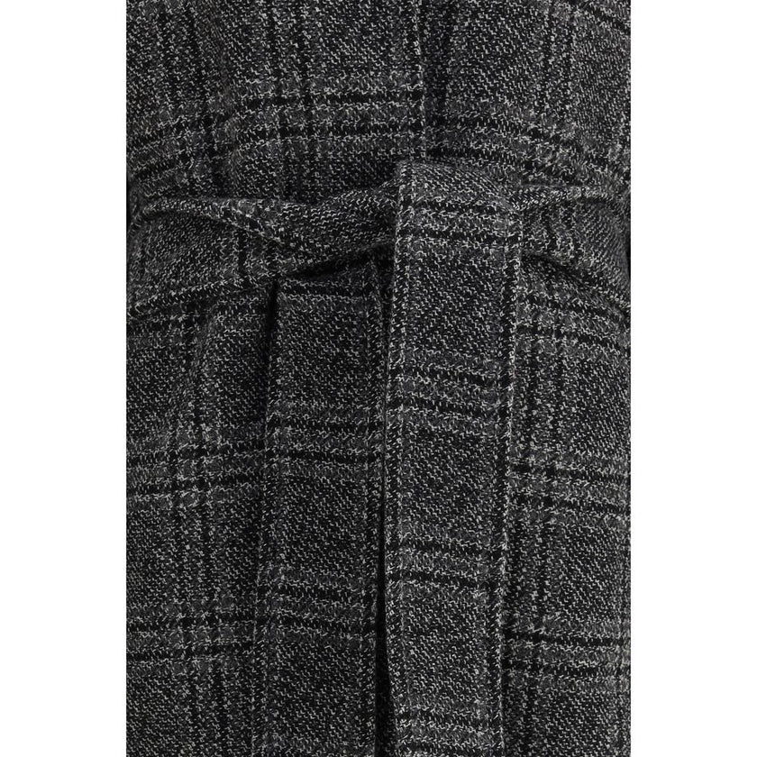 Gray Wool CoatBalenciaga’s Long Coat is a statement piece that combines elegance and character. Crafted from wool with a refined checked design, it features welt pockets on the front and distinctive details such as belt loops on the collar and sleeve. The