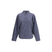 Blue Cotton Pattern ShirtThe Balenciaga Striped Shirt reinterprets a wardrobe classic with the brand’s bold aesthetic. Featuring a classic collar and a front button closure, it has an oversized design and two side vents that add movement and modernity. A