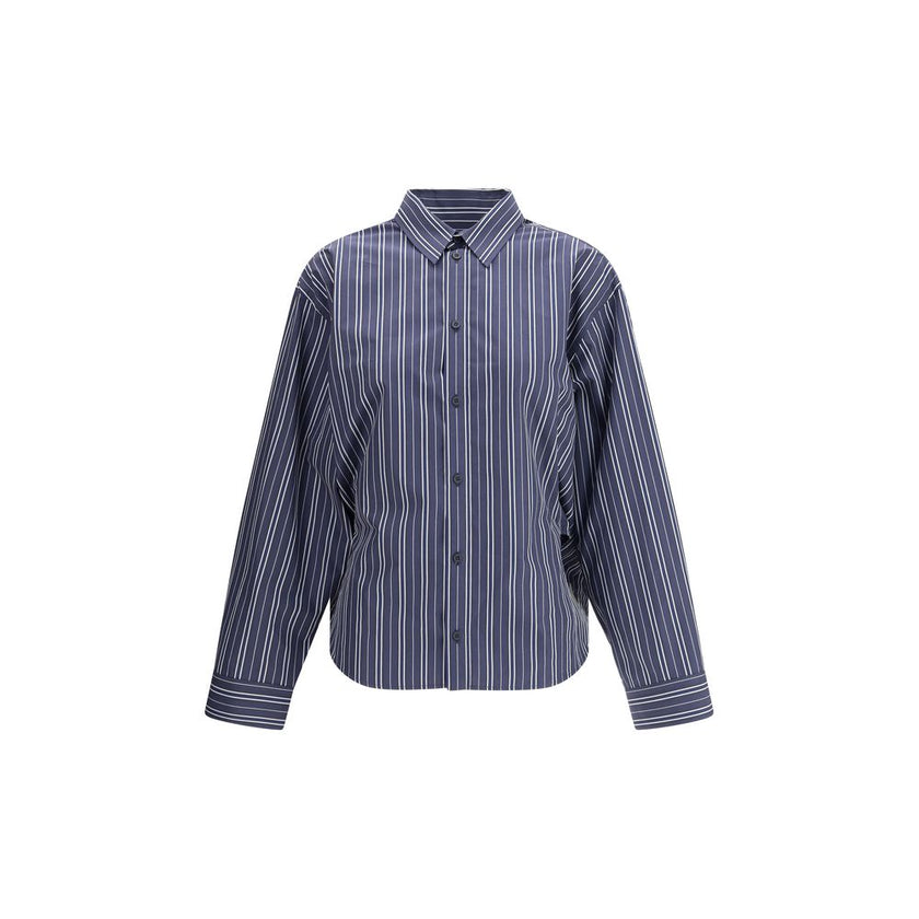 Blue Cotton Pattern ShirtThe Balenciaga Striped Shirt reinterprets a wardrobe classic with the brand’s bold aesthetic. Featuring a classic collar and a front button closure, it has an oversized design and two side vents that add movement and modernity. A