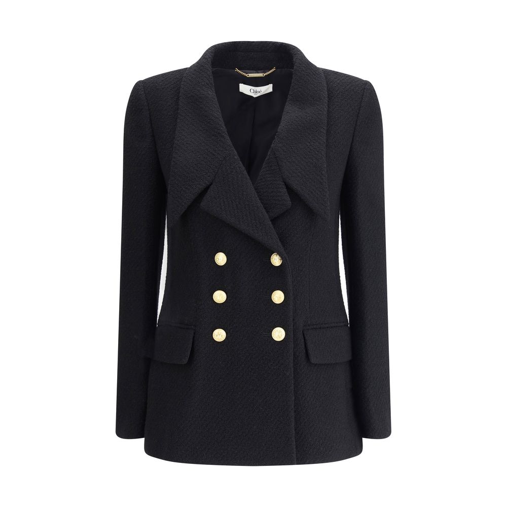 Bouclè wool BlazerThe Wool Blazer by Chloé expresses relaxed and sophisticated elegance. Crafted from soft bouclé wool, it features wide peak lapels and a front closure with embossed buttons that add a distinctive touch. The two patch pockets with flap co