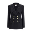 Bouclè wool BlazerThe Wool Blazer by Chloé expresses relaxed and sophisticated elegance. Crafted from soft bouclé wool, it features wide peak lapels and a front closure with embossed buttons that add a distinctive touch. The two patch pockets with flap co