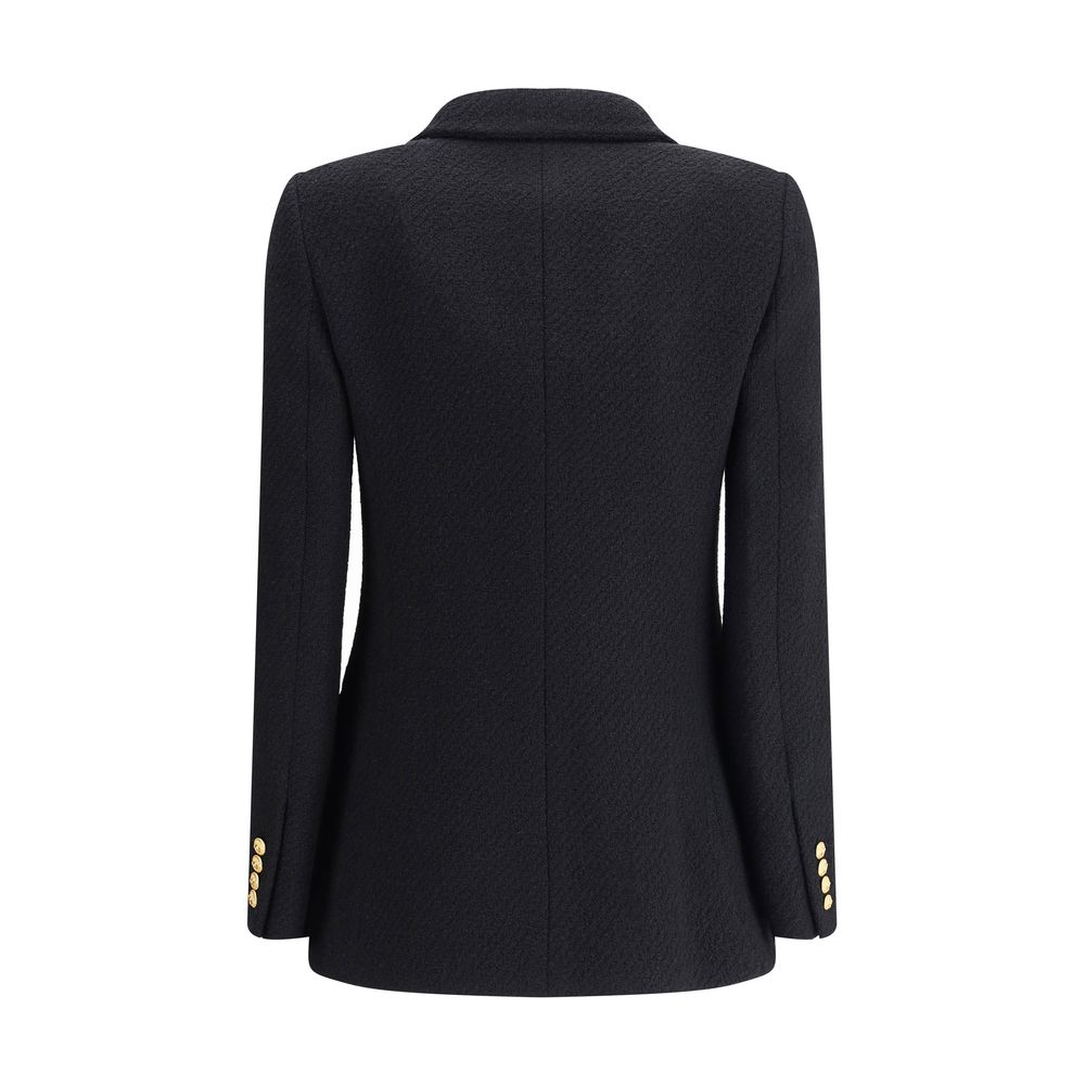 Bouclè wool BlazerThe Wool Blazer by Chloé expresses relaxed and sophisticated elegance. Crafted from soft bouclé wool, it features wide peak lapels and a front closure with embossed buttons that add a distinctive touch. The two patch pockets with flap co