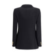 Bouclè wool BlazerThe Wool Blazer by Chloé expresses relaxed and sophisticated elegance. Crafted from soft bouclé wool, it features wide peak lapels and a front closure with embossed buttons that add a distinctive touch. The two patch pockets with flap co