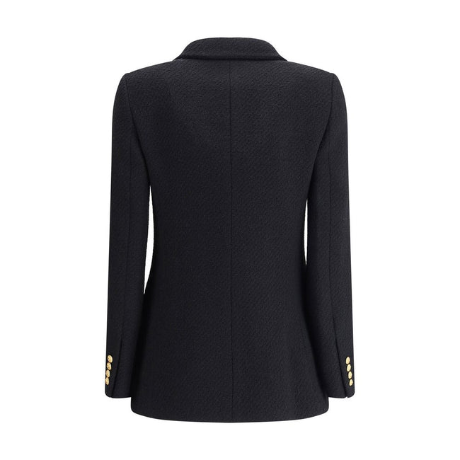 Bouclè wool BlazerThe Wool Blazer by Chloé expresses relaxed and sophisticated elegance. Crafted from soft bouclé wool, it features wide peak lapels and a front closure with embossed buttons that add a distinctive touch. The two patch pockets with flap co