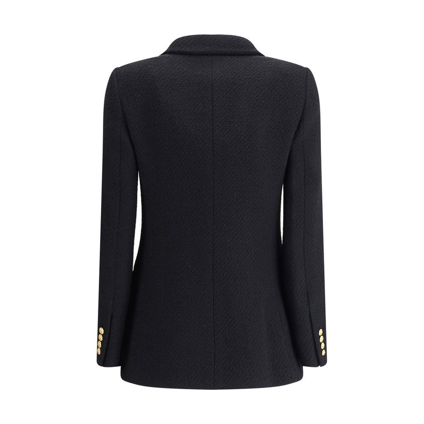 Bouclè wool BlazerThe Wool Blazer by Chloé expresses relaxed and sophisticated elegance. Crafted from soft bouclé wool, it features wide peak lapels and a front closure with embossed buttons that add a distinctive touch. The two patch pockets with flap co