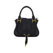 Marcie HandbagCalfskin Marcie Handbag by Chloé, double rigid leather top handle, removable and adjustable leather shoulder strap, top zipper closure, front flap with iconic leather tassel detail, iconic brand monogram press-stamped on front, open front po