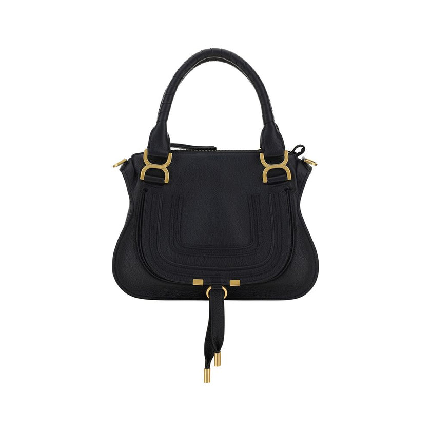 Marcie HandbagCalfskin Marcie Handbag by Chloé, double rigid leather top handle, removable and adjustable leather shoulder strap, top zipper closure, front flap with iconic leather tassel detail, iconic brand monogram press-stamped on front, open front po