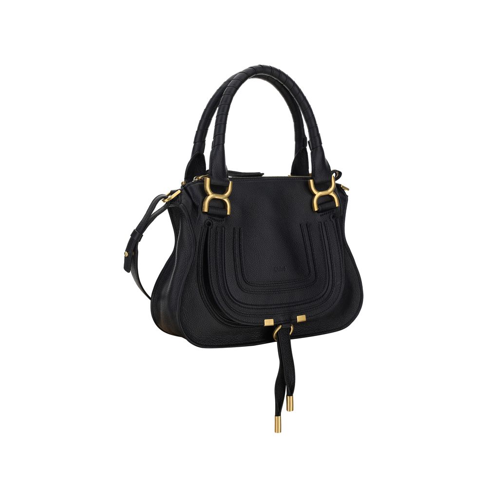 Marcie HandbagCalfskin Marcie Handbag by Chloé, double rigid leather top handle, removable and adjustable leather shoulder strap, top zipper closure, front flap with iconic leather tassel detail, iconic brand monogram press-stamped on front, open front po