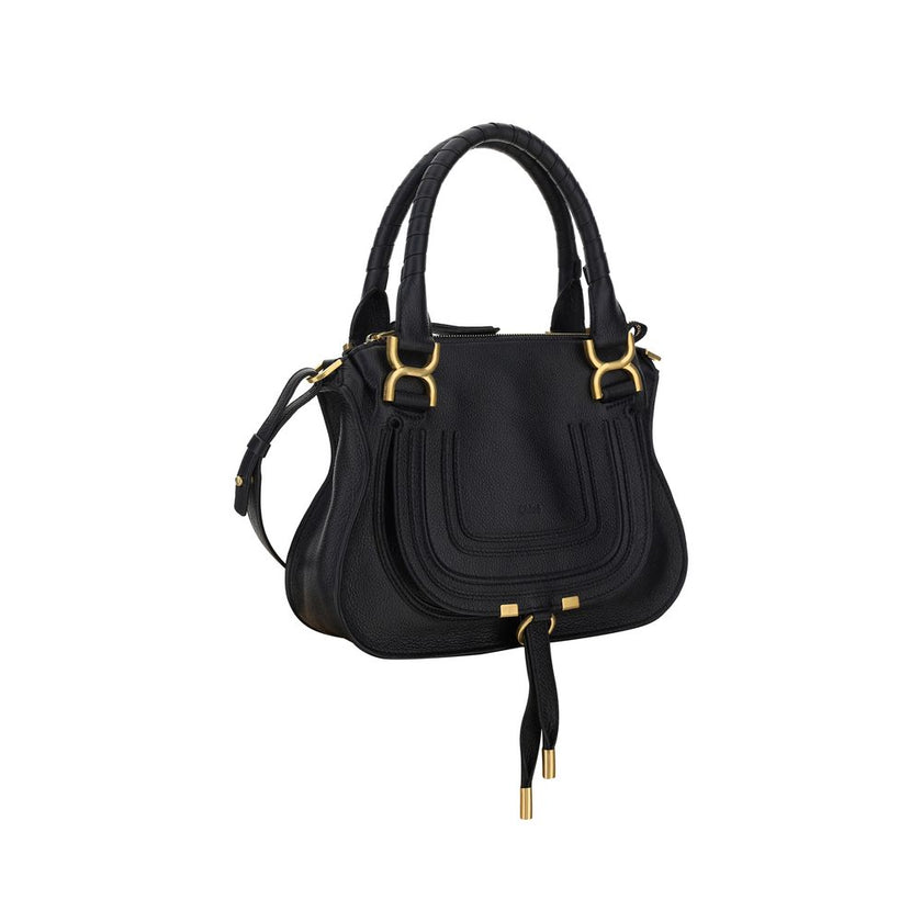 Marcie HandbagCalfskin Marcie Handbag by Chloé, double rigid leather top handle, removable and adjustable leather shoulder strap, top zipper closure, front flap with iconic leather tassel detail, iconic brand monogram press-stamped on front, open front po