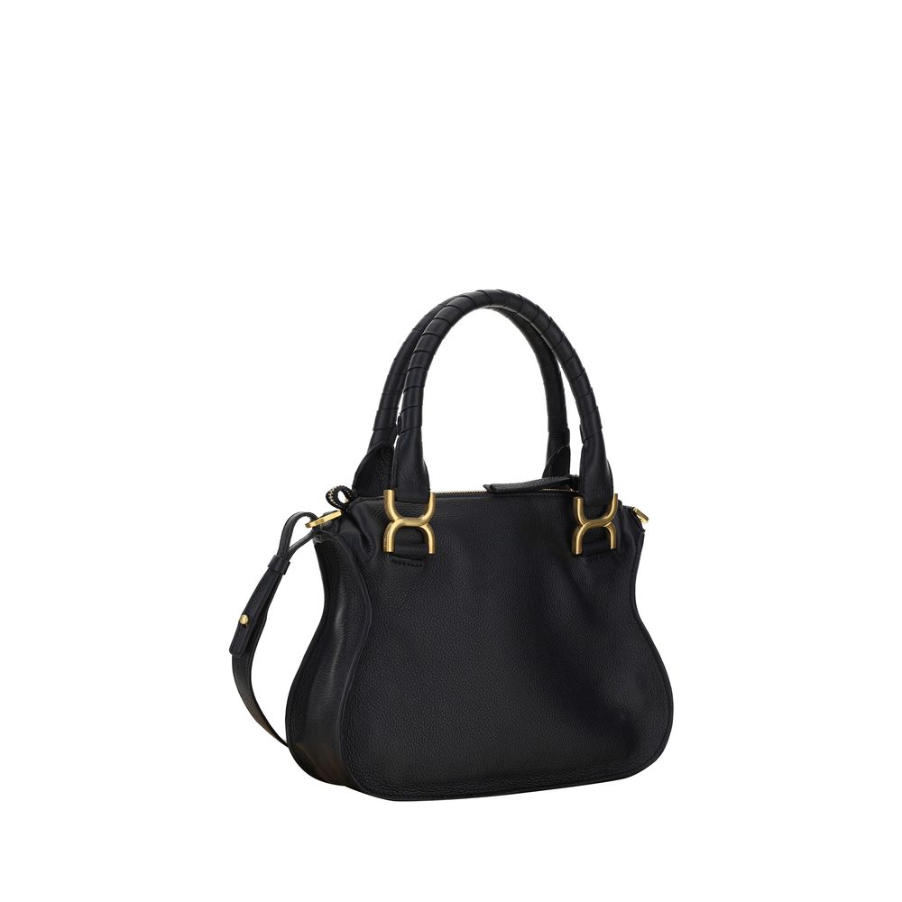 Marcie HandbagCalfskin Marcie Handbag by Chloé, double rigid leather top handle, removable and adjustable leather shoulder strap, top zipper closure, front flap with iconic leather tassel detail, iconic brand monogram press-stamped on front, open front po