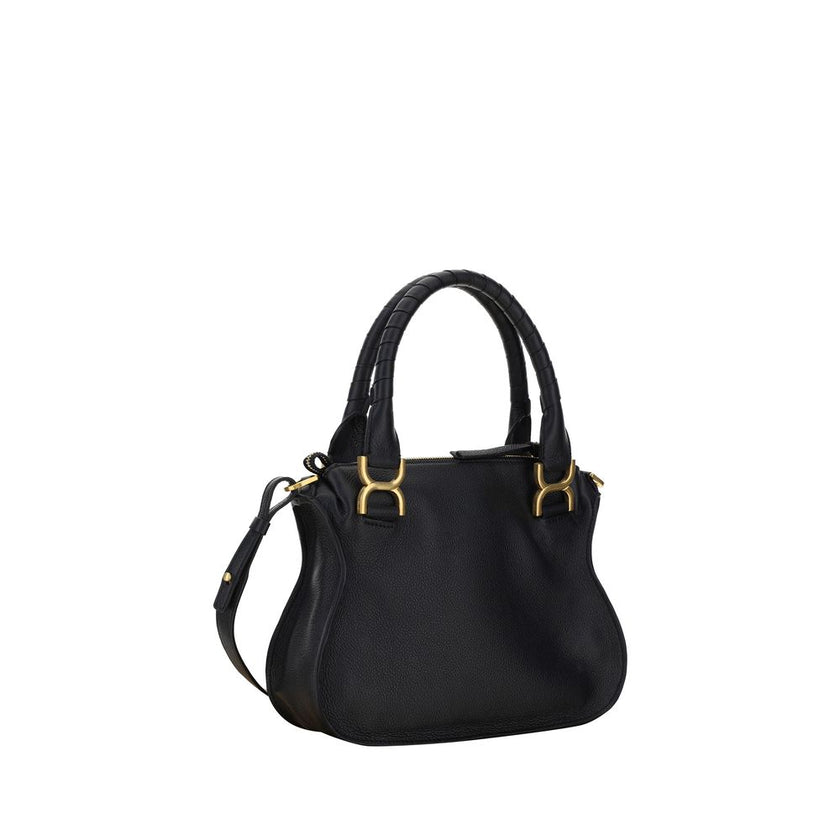 Marcie HandbagCalfskin Marcie Handbag by Chloé, double rigid leather top handle, removable and adjustable leather shoulder strap, top zipper closure, front flap with iconic leather tassel detail, iconic brand monogram press-stamped on front, open front po