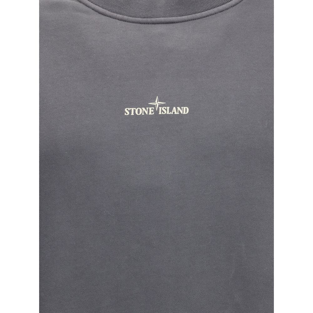 Logo SweatshirtThe Stone Island Logo Sweatshirt features a ribbed collar and ribbed cuffs and bottom band for a comfortable and defined fit. A small Stone Island logo printed in the center of the chest stands out on the front, while the famous Stone Islan