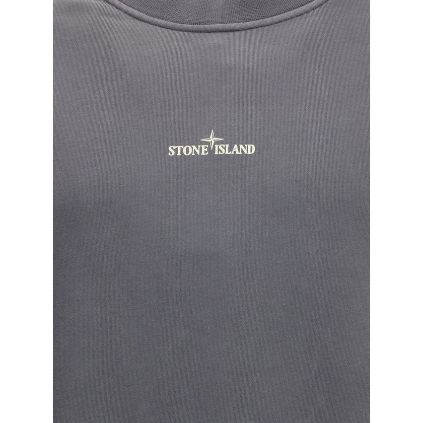 Logo SweatshirtThe Stone Island Logo Sweatshirt features a ribbed collar and ribbed cuffs and bottom band for a comfortable and defined fit. A small Stone Island logo printed in the center of the chest stands out on the front, while the famous Stone Islan