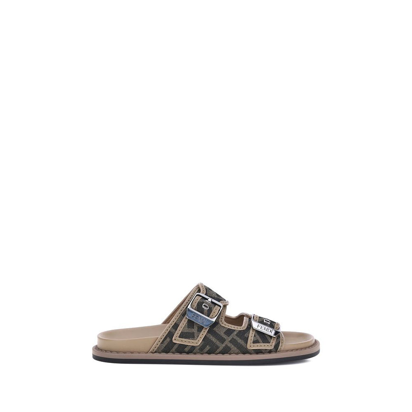 Brown Calf Leather Bos Taurus Flat SandalsLeather Sandals by Fendi with an open toe and two adjustable straps on the front, featuring a buckle. The slip-on style features a flat sole and the brand’s iconic all-over repeated FF pattern for a distinctive an