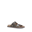 Brown Calf Leather Bos Taurus Flat SandalsLeather Sandals by Fendi with an open toe and two adjustable straps on the front, featuring a buckle. The slip-on style features a flat sole and the brand’s iconic all-over repeated FF pattern for a distinctive an
