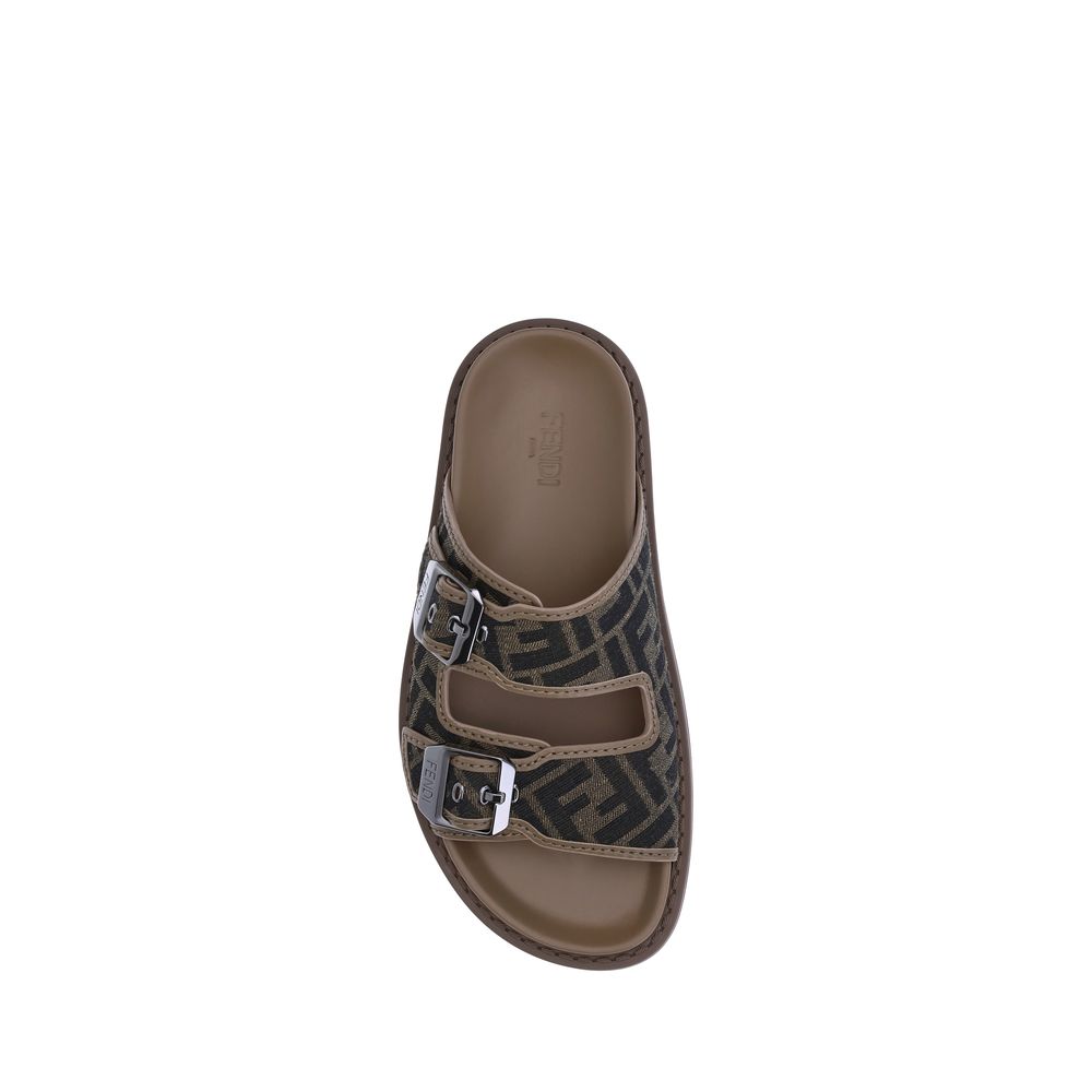 Brown Calf Leather Bos Taurus Flat SandalsLeather Sandals by Fendi with an open toe and two adjustable straps on the front, featuring a buckle. The slip-on style features a flat sole and the brand’s iconic all-over repeated FF pattern for a distinctive an