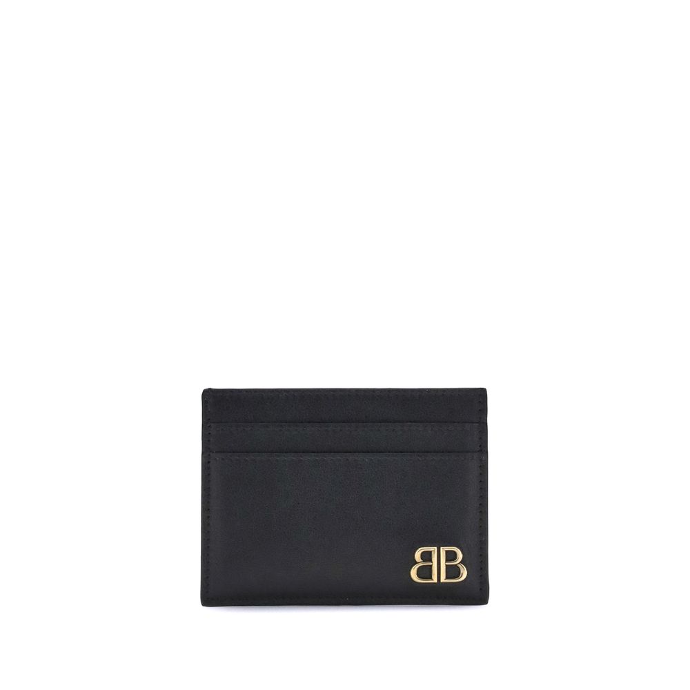 Black Calf Leather Bos Taurus WalletBalenciaga’s Monaco Card Holder combines practicality with sophisticated style. It features an inside pocket, two slots on the front and two on the back to conveniently organize cards. The gold logo plaque on the front