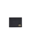 Black Calf Leather Bos Taurus WalletBalenciaga’s Monaco Card Holder combines practicality with sophisticated style. It features an inside pocket, two slots on the front and two on the back to conveniently organize cards. The gold logo plaque on the front