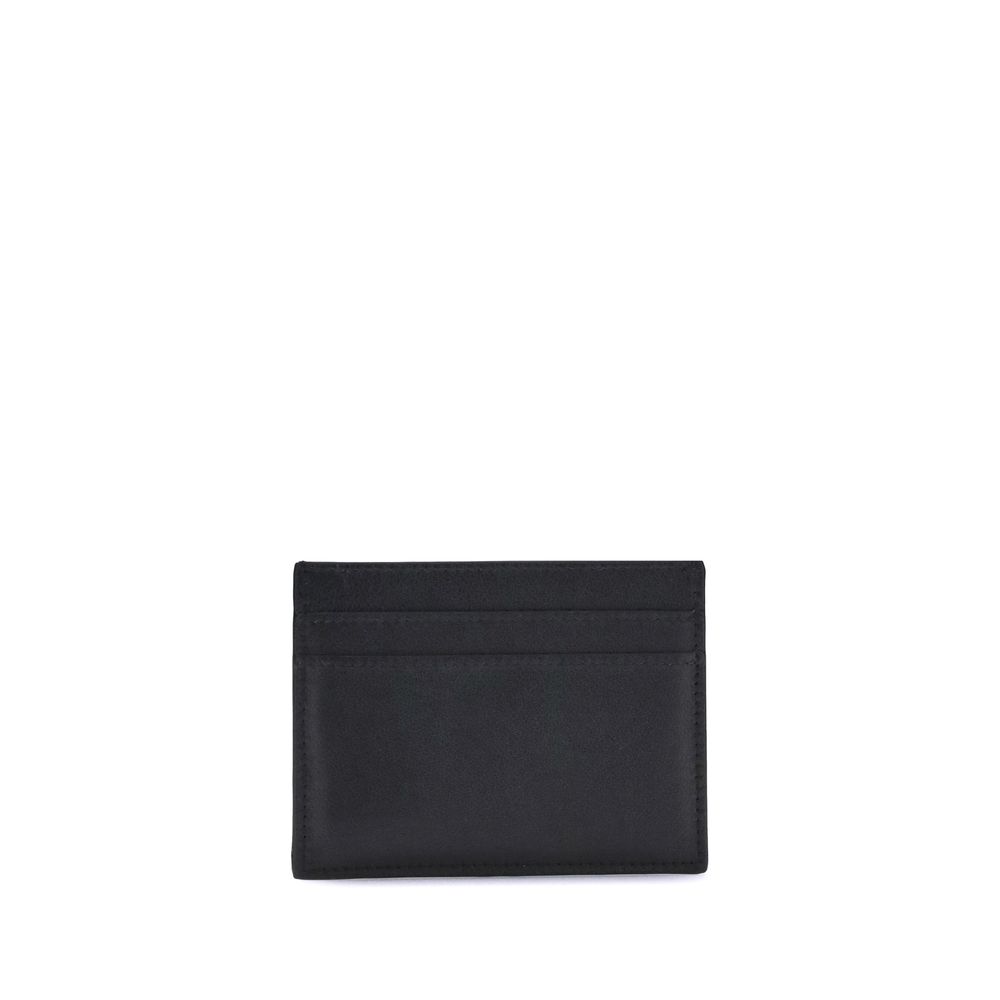 Black Calf Leather Bos Taurus WalletBalenciaga’s Monaco Card Holder combines practicality with sophisticated style. It features an inside pocket, two slots on the front and two on the back to conveniently organize cards. The gold logo plaque on the front