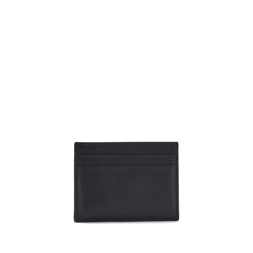 Black Calf Leather Bos Taurus WalletBalenciaga’s Monaco Card Holder combines practicality with sophisticated style. It features an inside pocket, two slots on the front and two on the back to conveniently organize cards. The gold logo plaque on the front