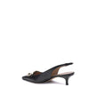 Black Calf Leather Bos Taurus PumpsThe Gancini slingback Pumps by Ferragamo combine classic elegance and iconic details. The softly rounded neckline enhances the silhouette of the foot, giving it a harmonious and feminine line. The famous Gancini ornament