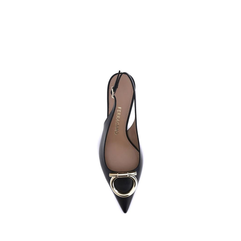 Black Calf Leather Bos Taurus PumpsThe Gancini slingback Pumps by Ferragamo combine classic elegance and iconic details. The softly rounded neckline enhances the silhouette of the foot, giving it a harmonious and feminine line. The famous Gancini ornament