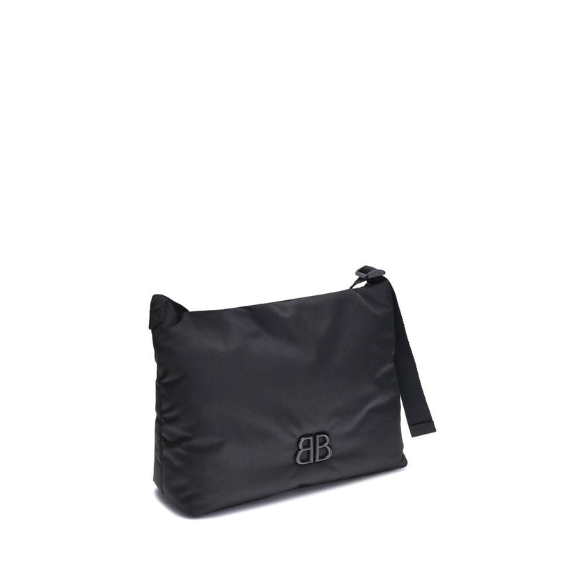 Black Fabric Shoulder BagFabric Shoulder Bag by Balenciaga with a contemporary and versatile design, ideal for everyday use. The flat shoulder strap ensures comfort and practicality, while the BB logoed magnetic flap closure adds a distinctive and prestig