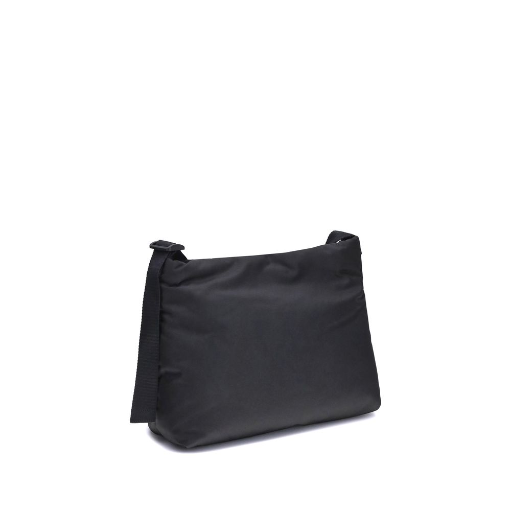 Black Fabric Shoulder BagFabric Shoulder Bag by Balenciaga with a contemporary and versatile design, ideal for everyday use. The flat shoulder strap ensures comfort and practicality, while the BB logoed magnetic flap closure adds a distinctive and prestig
