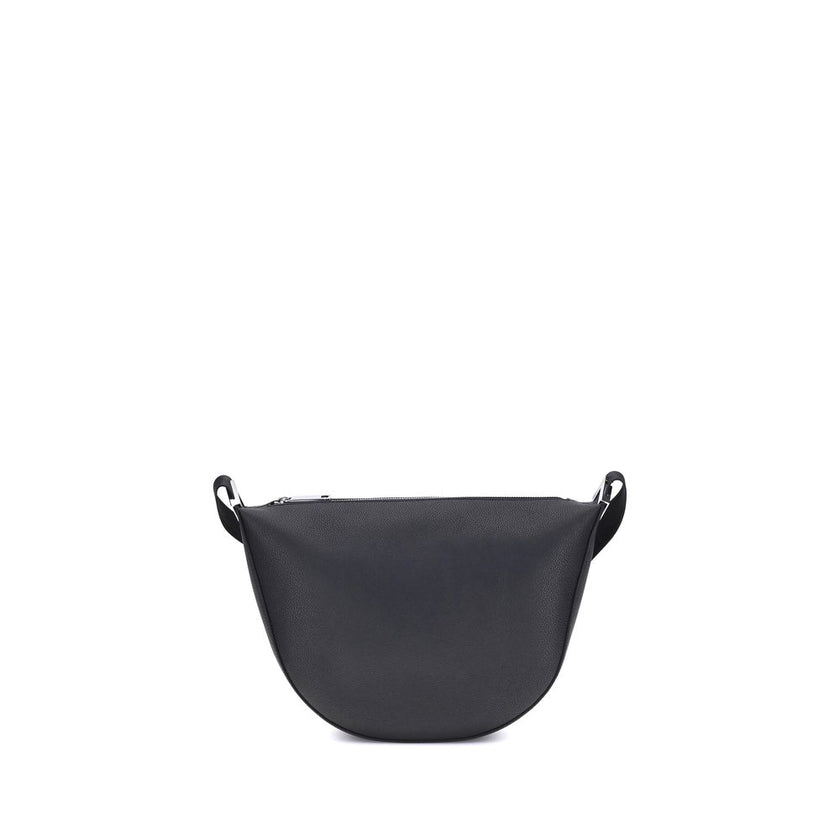 Black Calf Leather Bos Taurus Shoulder BagThe Fendi Melon Shoulder Bag, in the medium size, stands out for its elegant half-moon shape. Crafted from black grained leather, it is embellished with metal FF appliques on the corners and palladium-finish acces
