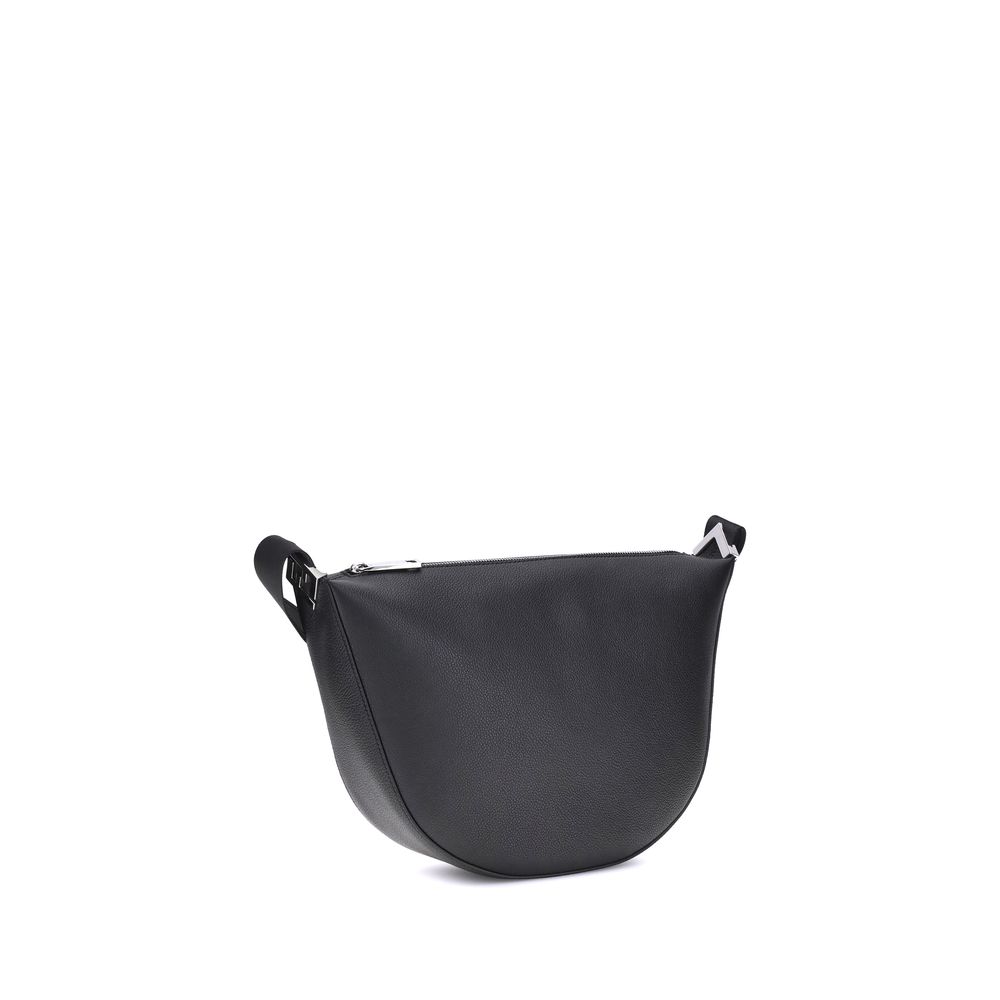 Black Calf Leather Bos Taurus Shoulder BagThe Fendi Melon Shoulder Bag, in the medium size, stands out for its elegant half-moon shape. Crafted from black grained leather, it is embellished with metal FF appliques on the corners and palladium-finish acces