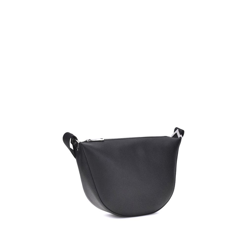 Black Calf Leather Bos Taurus Shoulder BagThe Fendi Melon Shoulder Bag, in the medium size, stands out for its elegant half-moon shape. Crafted from black grained leather, it is embellished with metal FF appliques on the corners and palladium-finish acces