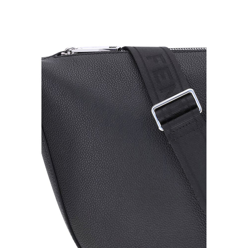 Black Calf Leather Bos Taurus Shoulder BagThe Fendi Melon Shoulder Bag, in the medium size, stands out for its elegant half-moon shape. Crafted from black grained leather, it is embellished with metal FF appliques on the corners and palladium-finish acces