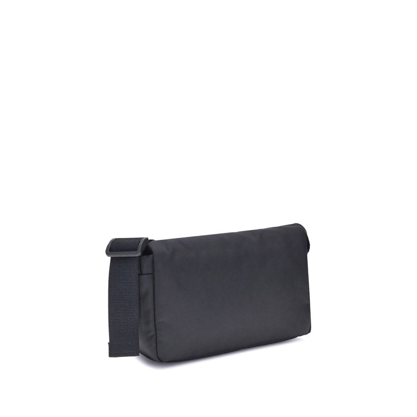 Black Polyamide Shoulder BagBalenciaga’s Monaco Shoulder Bag, made of lightweight and durable nylon, stands out for its minimalist and functional design. The top flap with magnetic closure ensures practicality, while the adjustable shoulder strap allows f