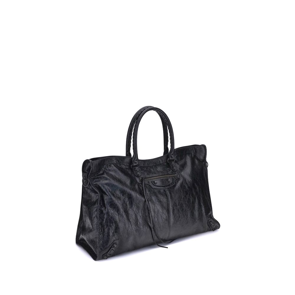 Black Calf Leather Bos Taurus Shoulder BagBalenciaga’s Le City Travel Bag is a high-class item made of fine lambskin leather that combines elegance and functionality. The two hand-woven leather handles lend a handcrafted and refined touch, while the adjus