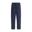Blue Cotton Casual PantsPrada’s Cotton Pants combine comfort and style with an elasticized drawstring waistband and front zipper closure. They feature two side welt pockets and two patch pockets on the back, embellished with the iconic logo that adds a di