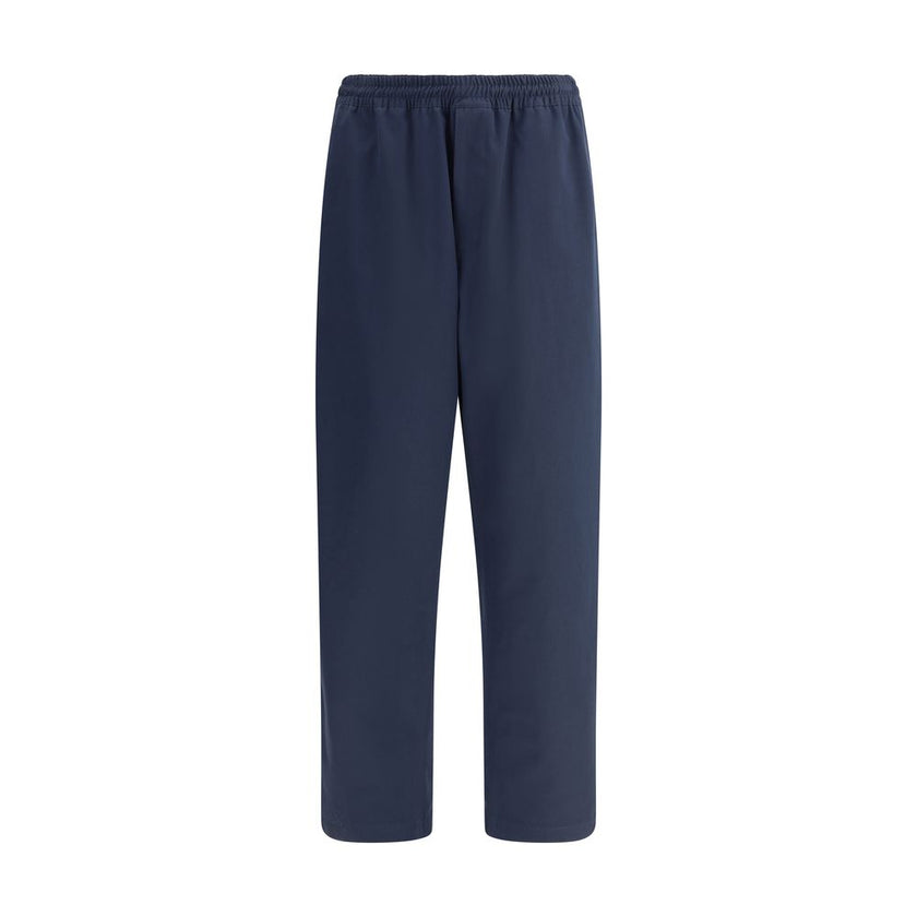 Blue Cotton Casual PantsPrada’s Cotton Pants combine comfort and style with an elasticized drawstring waistband and front zipper closure. They feature two side welt pockets and two patch pockets on the back, embellished with the iconic logo that adds a di