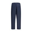 Blue Cotton Casual PantsPrada’s Cotton Pants combine comfort and style with an elasticized drawstring waistband and front zipper closure. They feature two side welt pockets and two patch pockets on the back, embellished with the iconic logo that adds a di